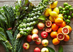 a group of fruits and vegetables on a wood surface Healthy Weight Loss Diets Wokingham